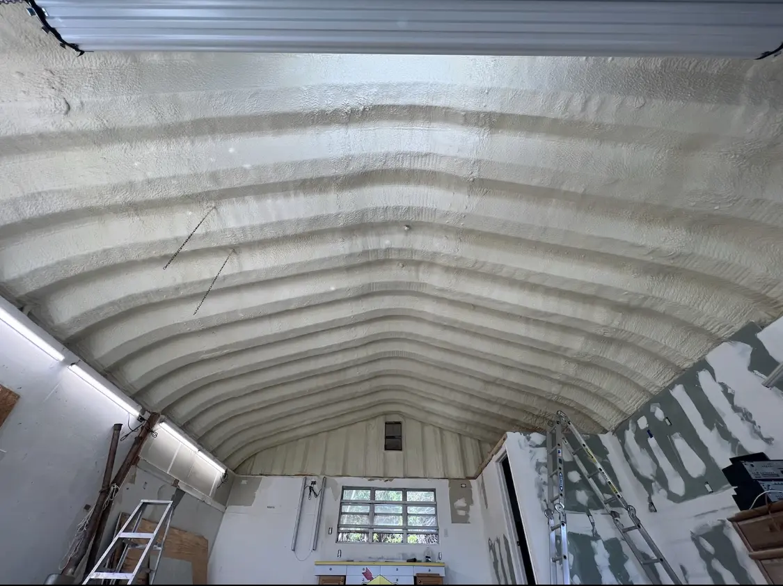 Spray polyurethane foam applied to the underside of a metal roof deck in Brushy Creek